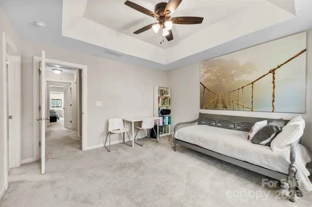 an aerial view of residential houses with outdoor space and swimming pool