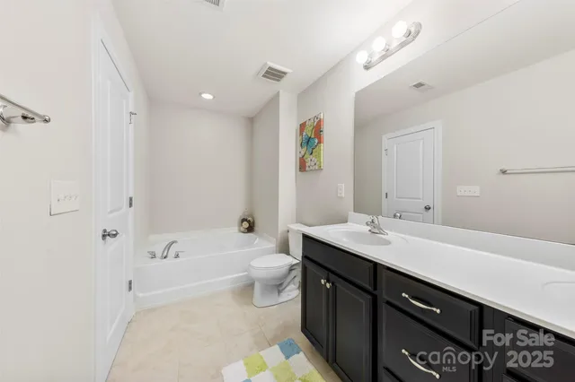 an aerial view of house with swimming pool