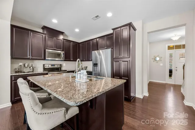 a spacious bathroom with a toilet a sink and glass door