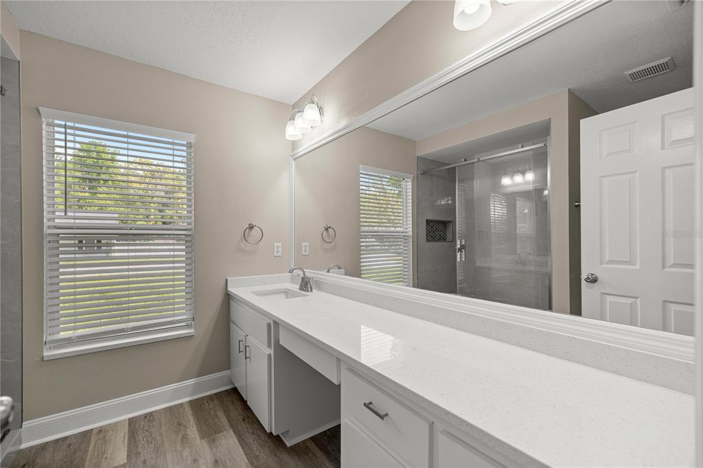 46 Teak Run Ocala, FL 34472 - Photo 12 of 26 a spacious bathroom with a shower sink and mirror