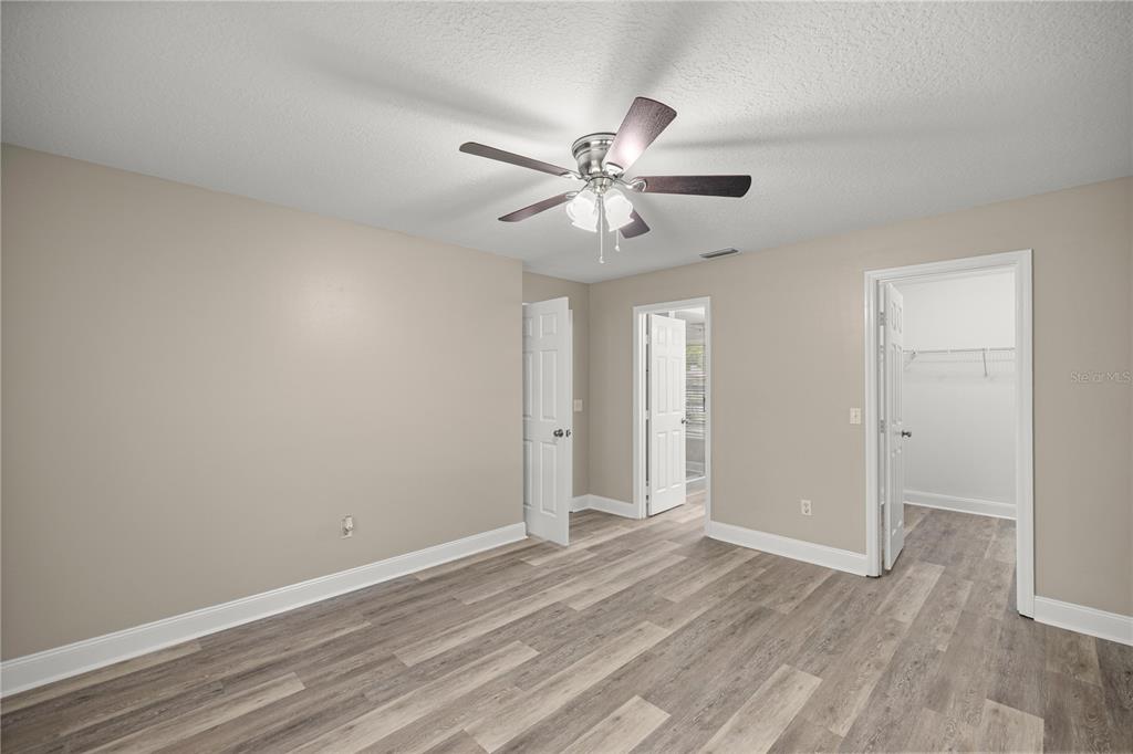 46 Teak Run Ocala, FL 34472 - Photo 13 of 26 a view of a room with a ceiling fan and wooden floor