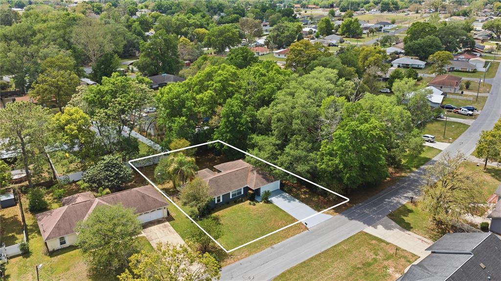 46 Teak Run Ocala, FL 34472 - Photo 2 of 26 a view of a house with a small yard and sitting area