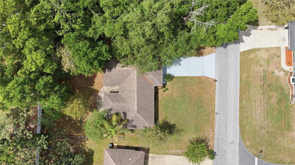 46 Teak Run Ocala, FL 34472 - Photo 26 of 26 an aerial view of a residential house with trees all around