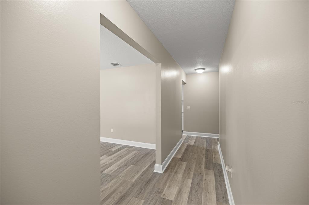 46 Teak Run Ocala, FL 34472 - Photo 6 of 26 a view of a room with wooden floor and a bathroom