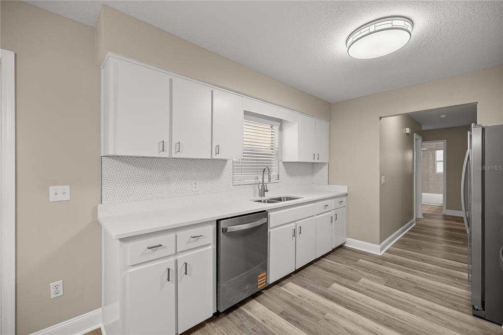 46 Teak Run Ocala, FL 34472 - Photo 10 of 26 a kitchen with sink cabinets and window