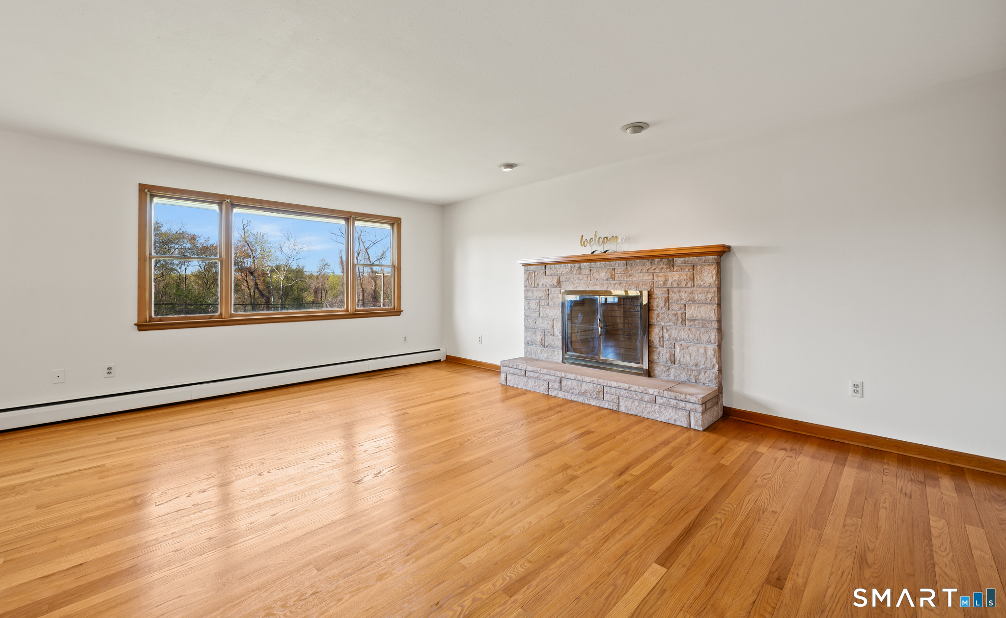 31 Grandview Terrace Portland, CT 06480 - Photo 14 of 40 a view of empty room with wooden floor and fan