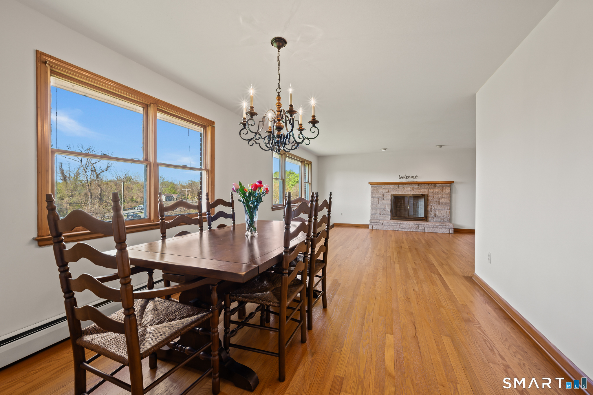 31 Grandview Terrace Portland, CT 06480 - Photo 17 of 40 a dining room with furniture a chandelier and wooden floor
