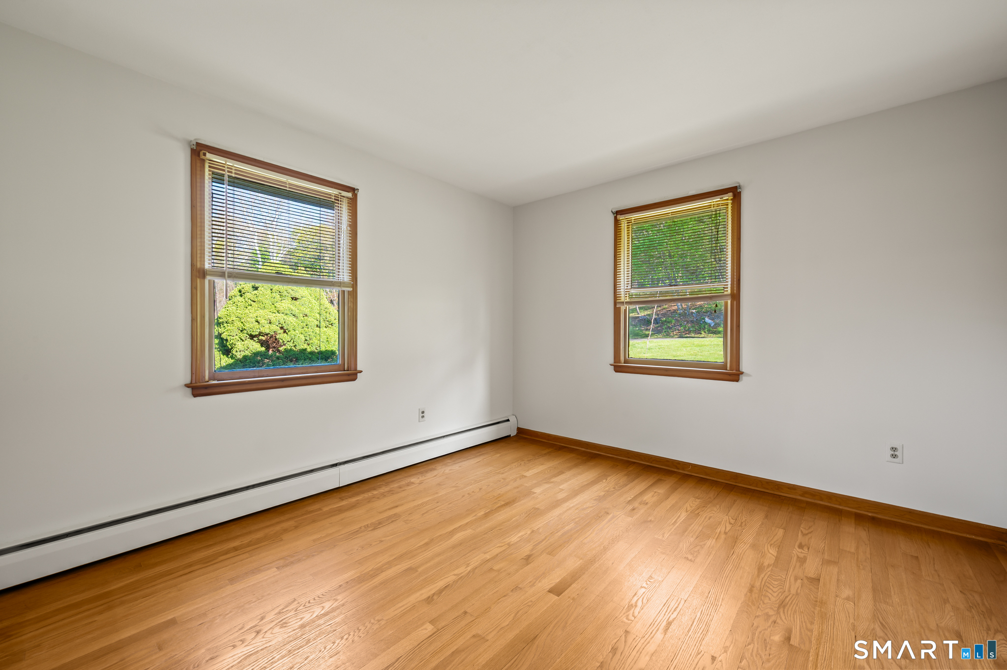 31 Grandview Terrace Portland, CT 06480 - Photo 27 of 40 a view of an empty room with a window and wooden floor