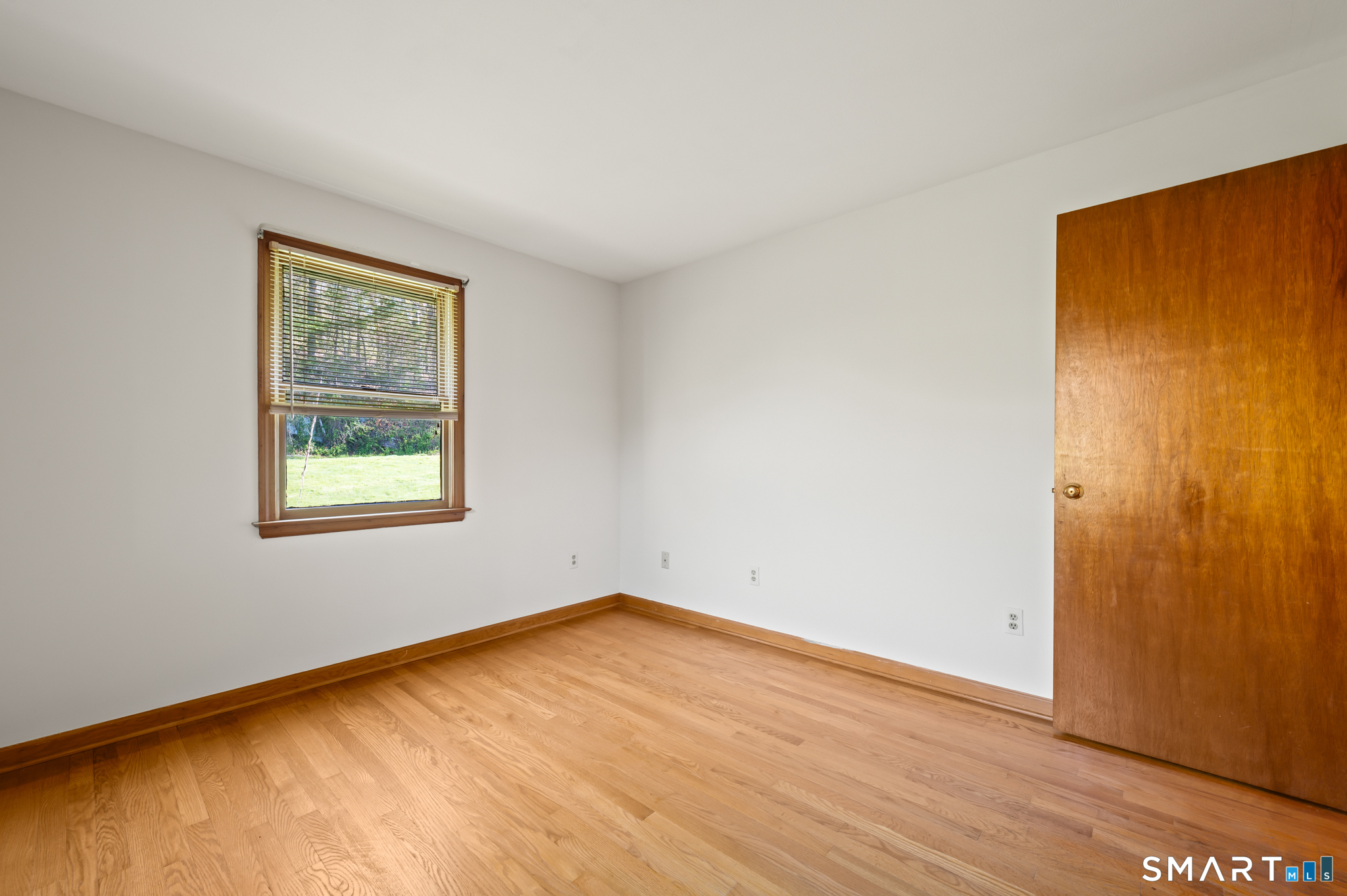 31 Grandview Terrace Portland, CT 06480 - Photo 28 of 40 a view of empty room with wooden floor and fan