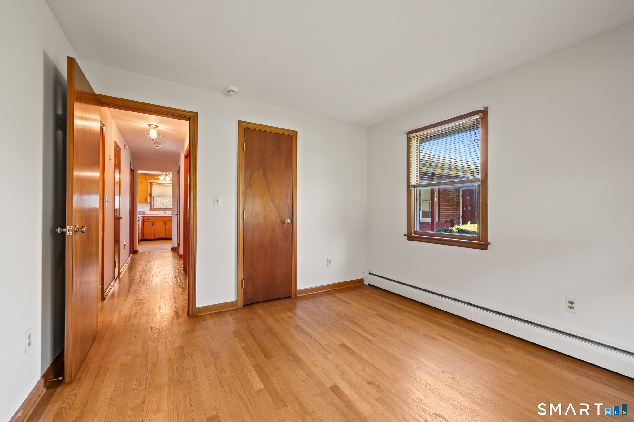 31 Grandview Terrace Portland, CT 06480 - Photo 29 of 40 a view of an empty room with wooden floor and a window