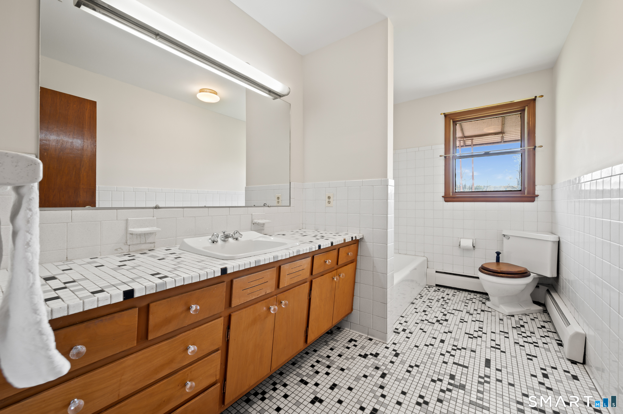 31 Grandview Terrace Portland, CT 06480 - Photo 30 of 40 a bathroom with a sink a toilet and mirror
