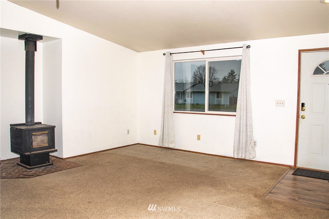 8723 Hawks Glen Loop Southeast Olympia, WA 98513 - Photo 4 of 12 an empty room with windows