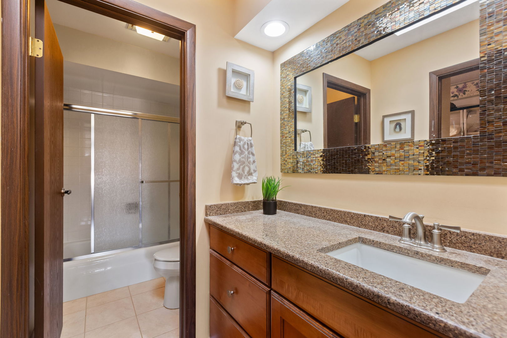 2425 El Cid Lane Northbrook, IL 60062 - Photo 22 of 28 a bathroom with a granite countertop sink and a mirror