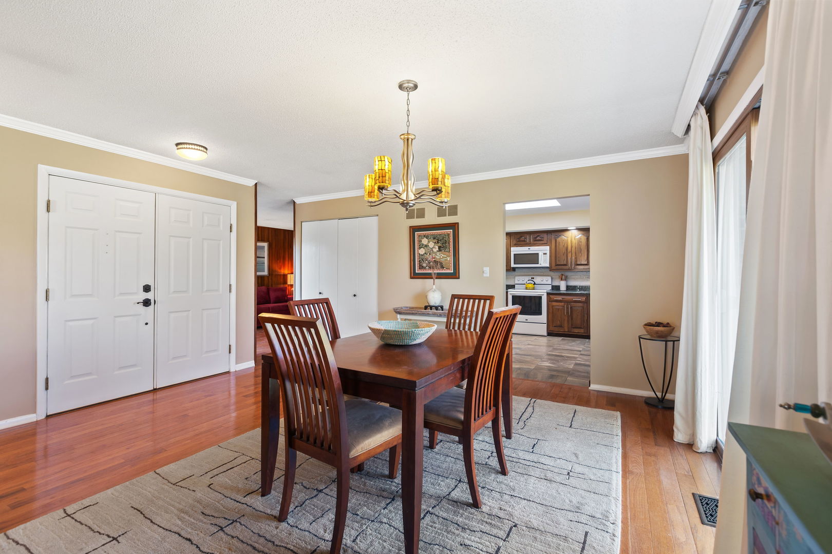 2425 El Cid Lane Northbrook, IL 60062 - Photo 8 of 28 a view of a dining room with furniture window and wooden floor