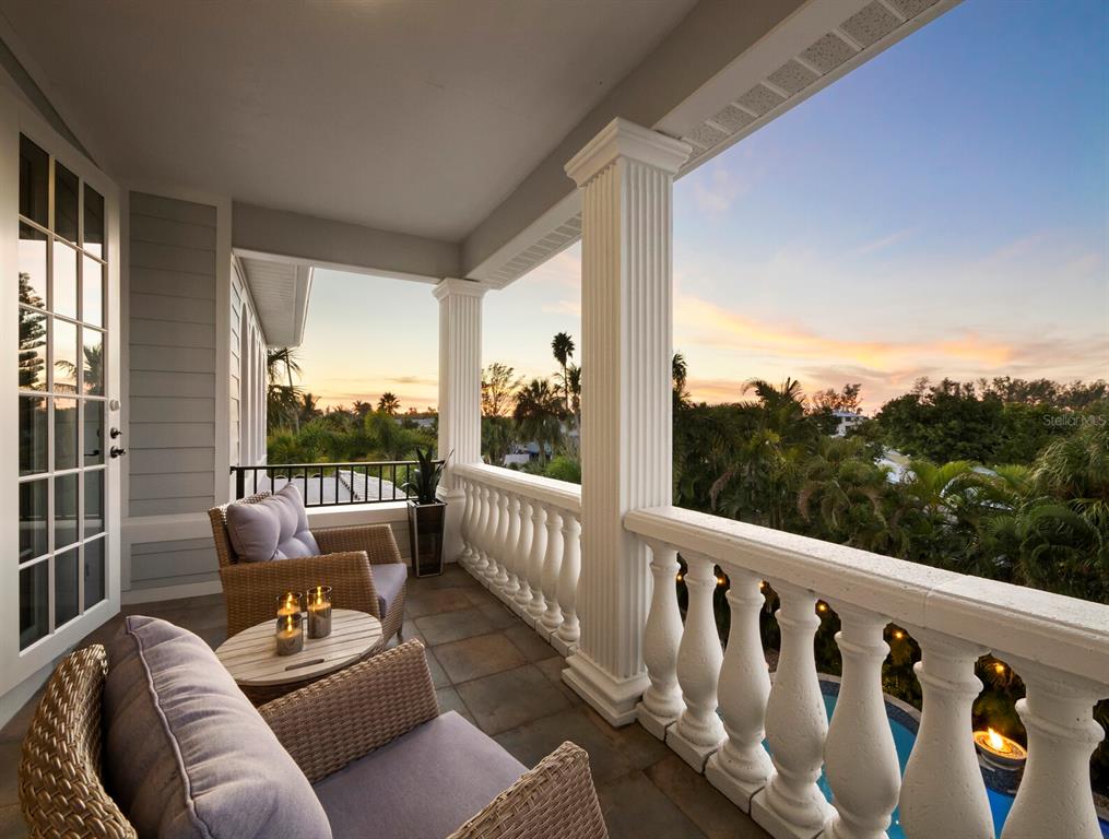 651 Broadway Street Longboat Key, FL 34228 - Photo 32 of 75 a balcony with couch