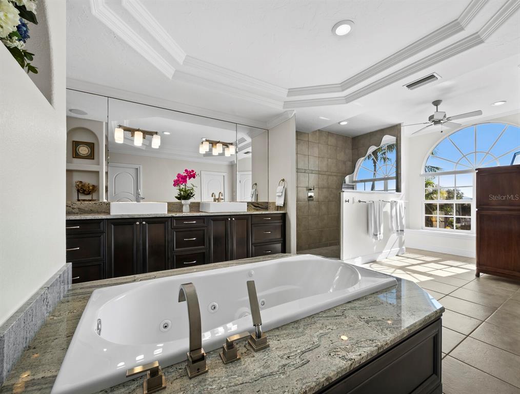 651 Broadway Street Longboat Key, FL 34228 - Photo 34 of 75 a view of kitchen with stainless steel appliances kitchen island granite countertop a sink and cabinets