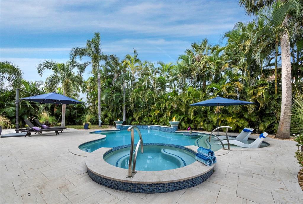 651 Broadway Street Longboat Key, FL 34228 - Photo 39 of 75 a view of a swimming pool with a patio and a yard