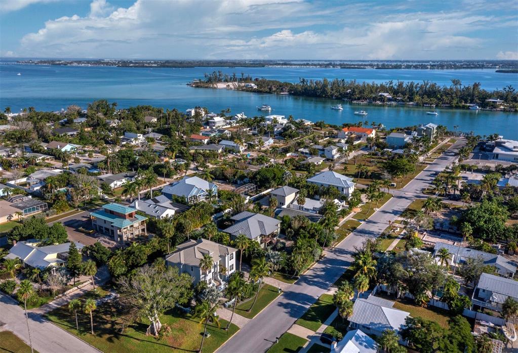 651 Broadway Street Longboat Key, FL 34228 - Photo 49 of 75 an aerial view of a house with a lake view