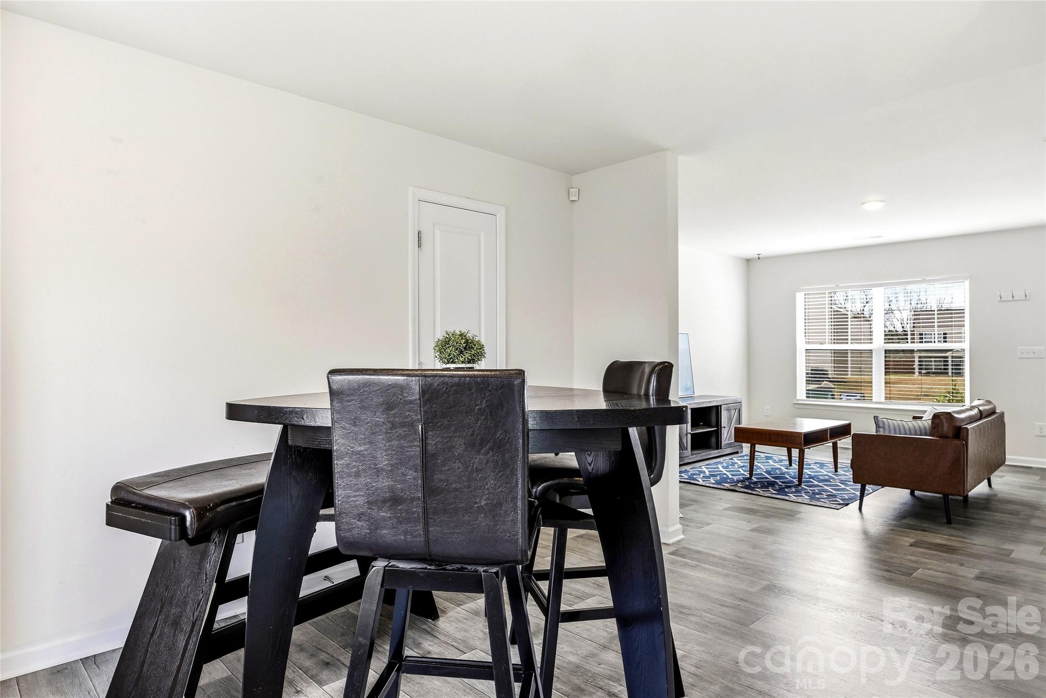 319 Oak Br Road Arden, NC 28704 - Photo 11 of 33 a view of a dining room with furniture window and wooden floor