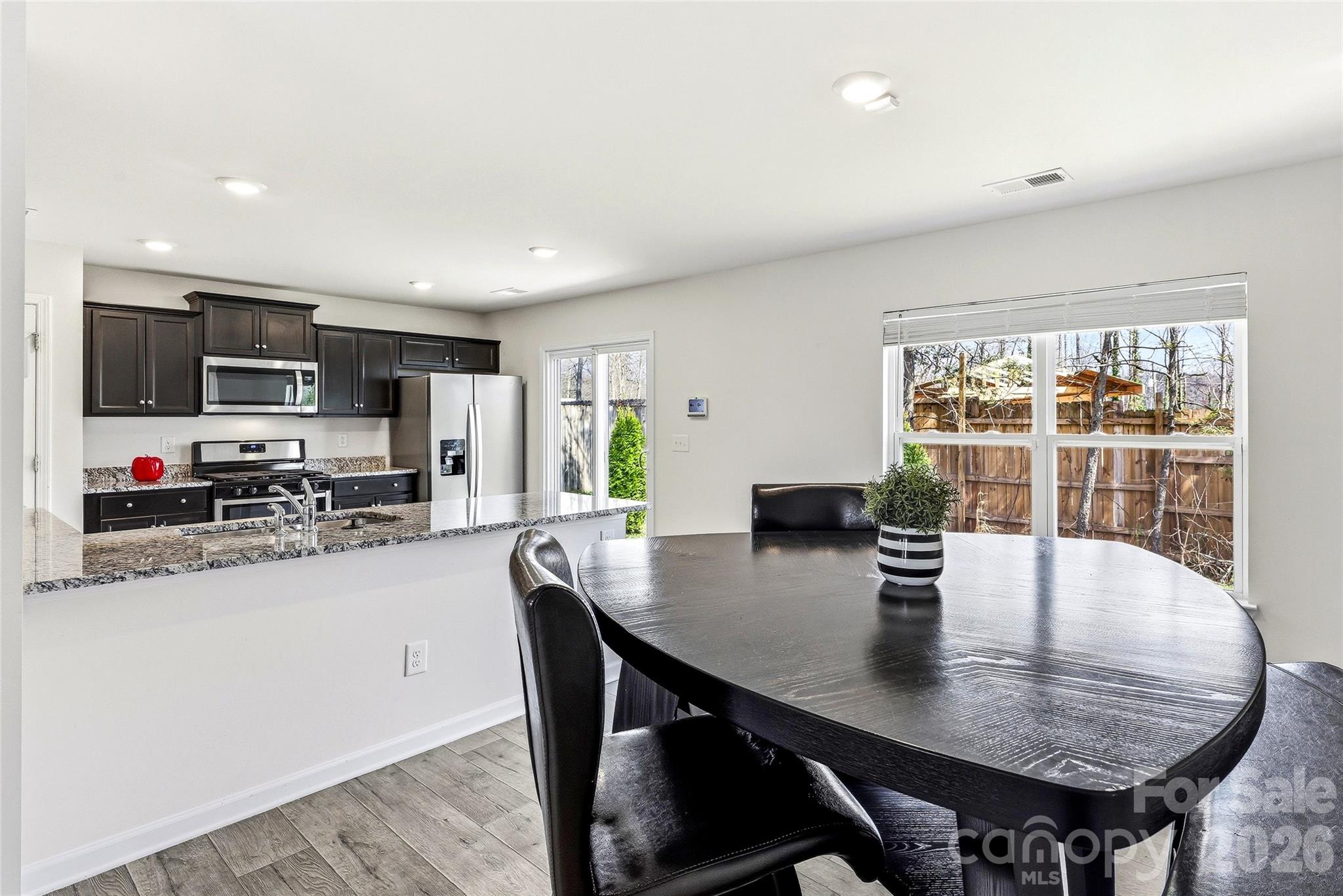 319 Oak Br Road Arden, NC 28704 - Photo 12 of 33 a view of a dining room with furniture