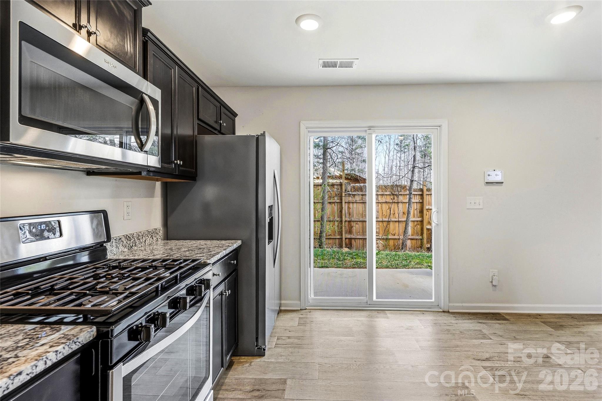 319 Oak Br Road Arden, NC 28704 - Photo 14 of 33 a kitchen with a stove and a microwave