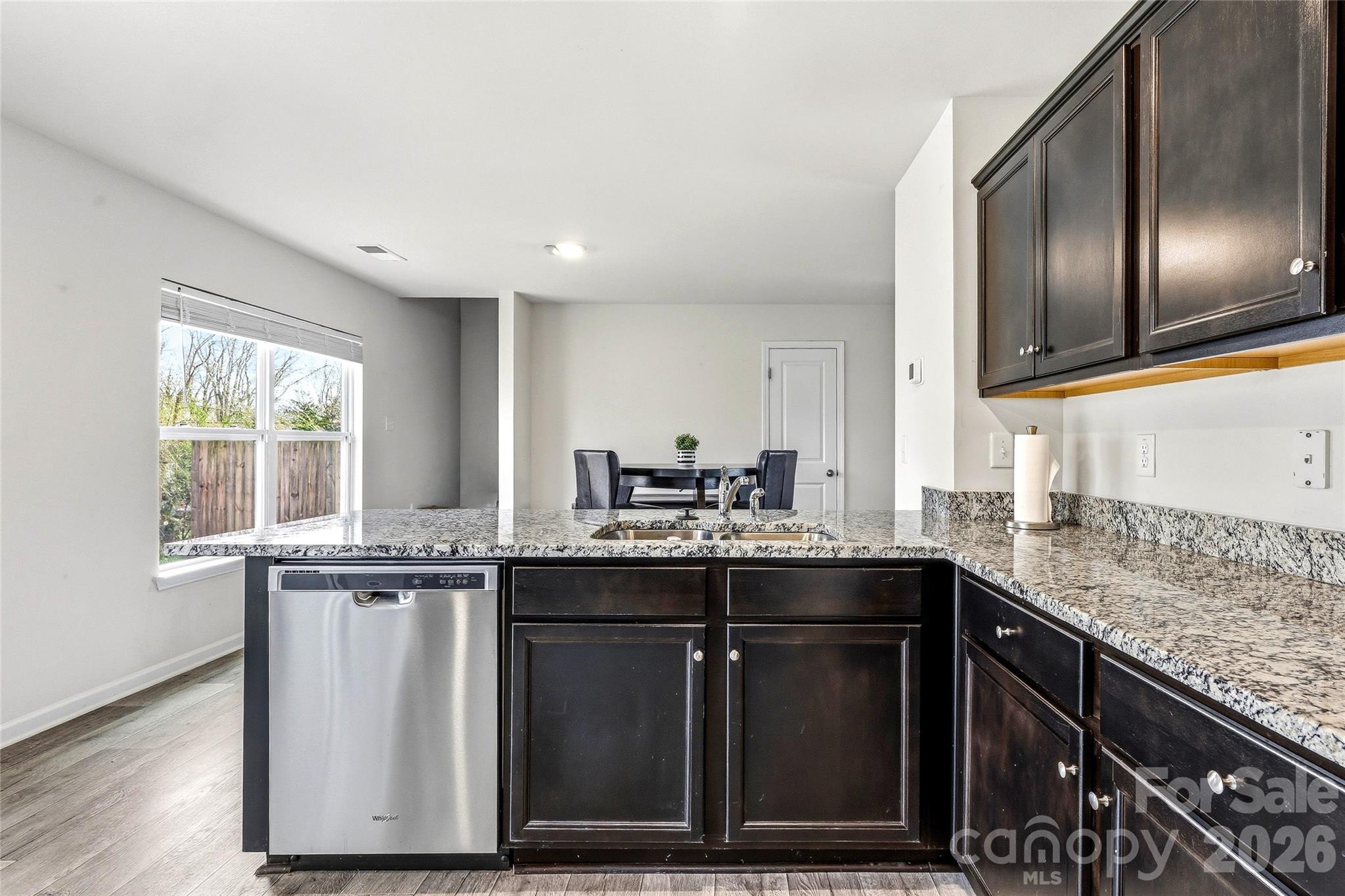 319 Oak Br Road Arden, NC 28704 - Photo 15 of 33 a kitchen with stainless steel appliances granite countertop a sink a stove a refrigerator and island with wooden floor