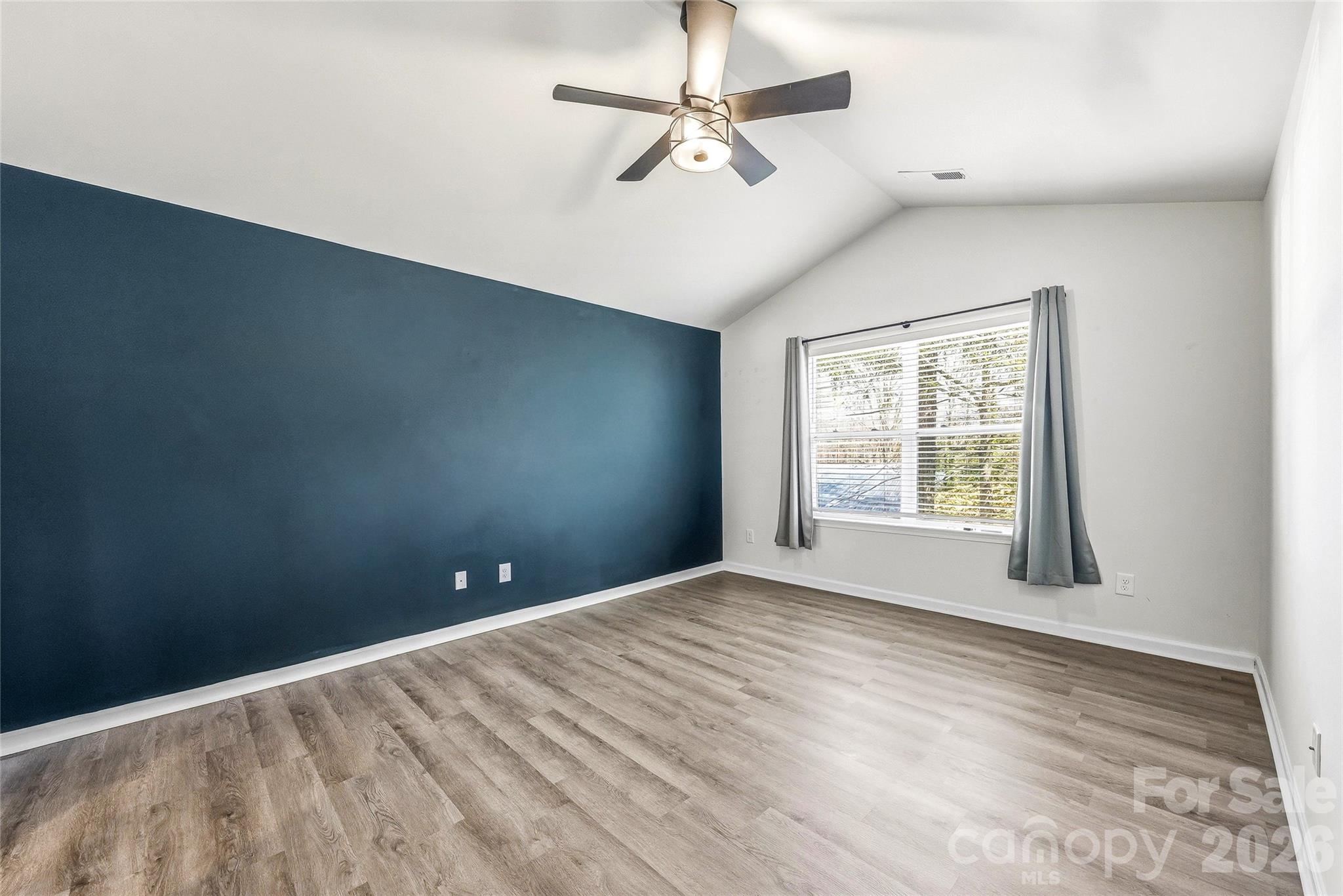 319 Oak Br Road Arden, NC 28704 - Photo 16 of 33 an empty room with windows and fan