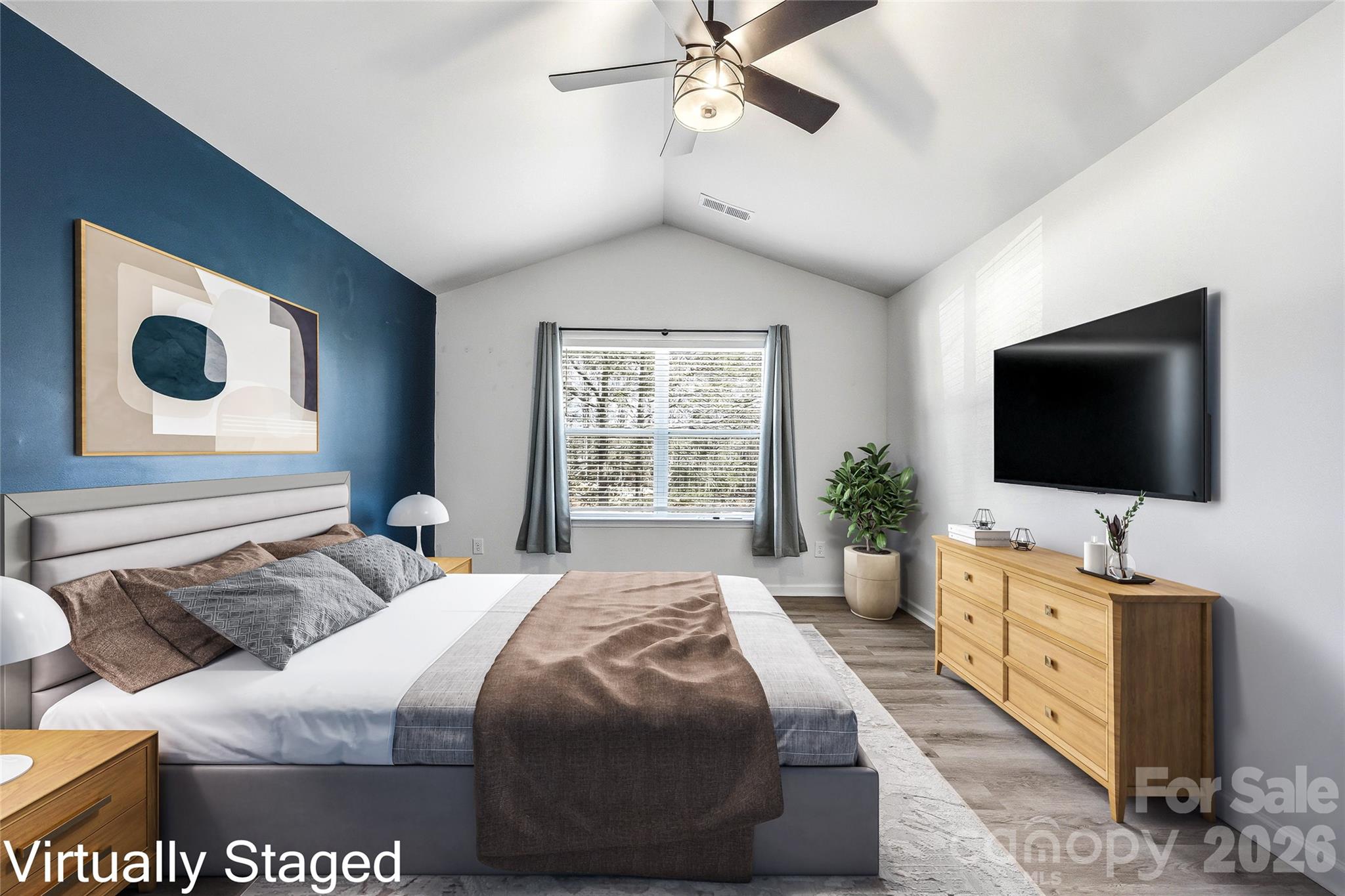 319 Oak Br Road Arden, NC 28704 - Photo 17 of 33 a bedroom with a bed and a flat screen tv