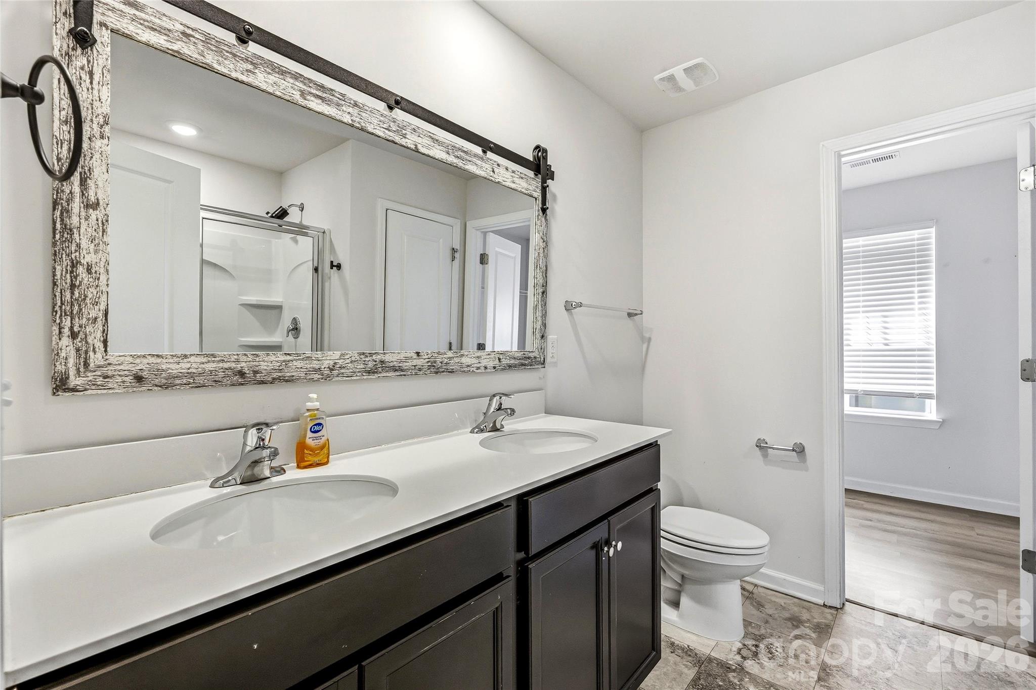 319 Oak Br Road Arden, NC 28704 - Photo 19 of 33 a bathroom with a sink and a mirror