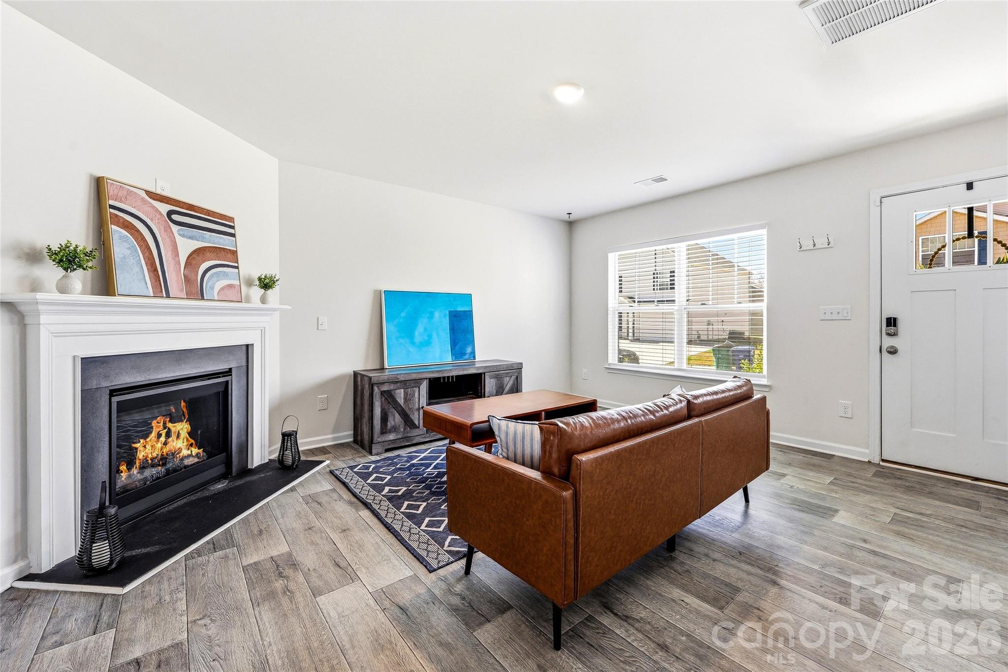 319 Oak Br Road Arden, NC 28704 - Photo 2 of 33 a living room with furniture and a fireplace