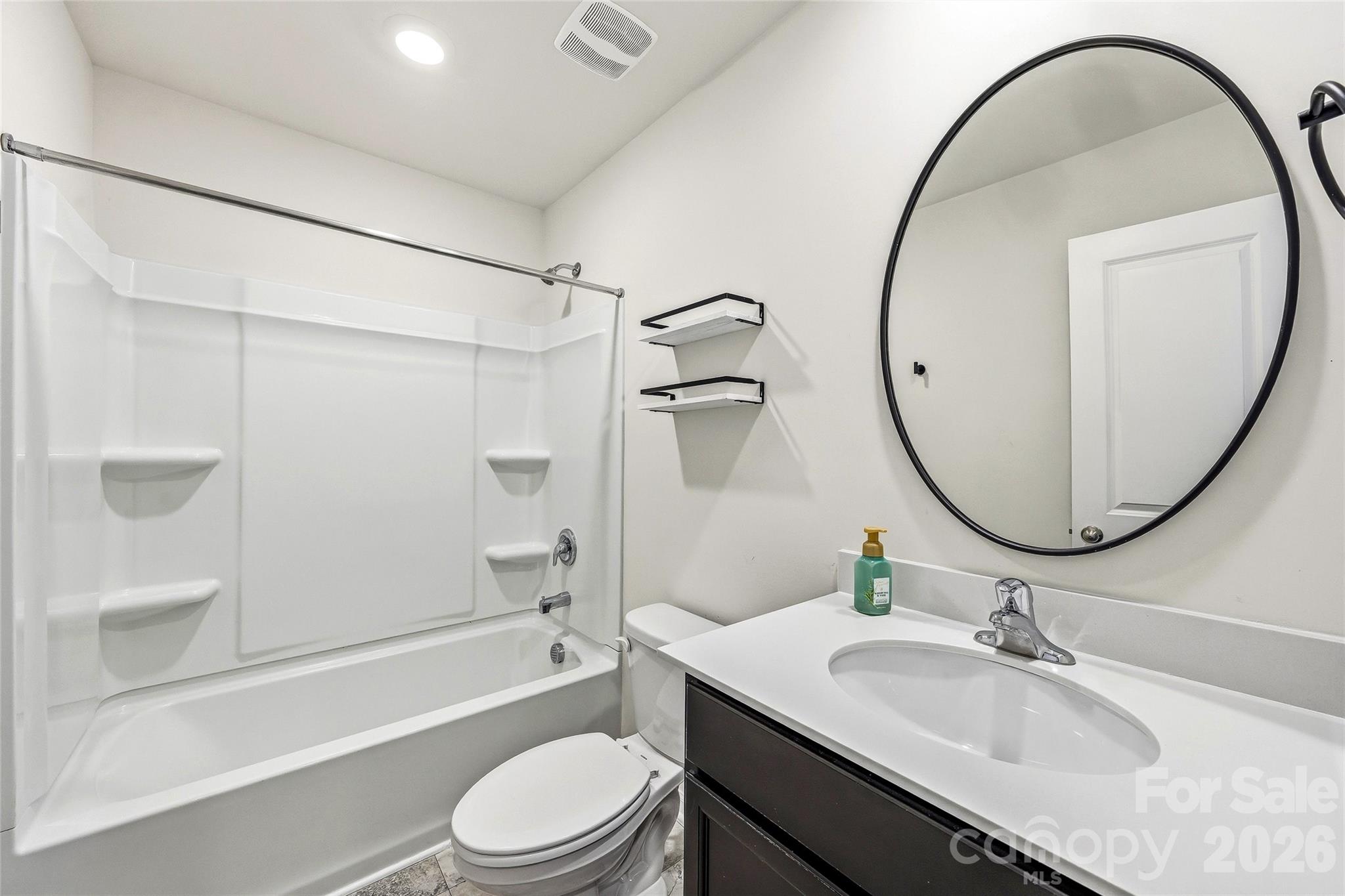 319 Oak Br Road Arden, NC 28704 - Photo 24 of 33 a bathroom with a sink toilet and a mirror