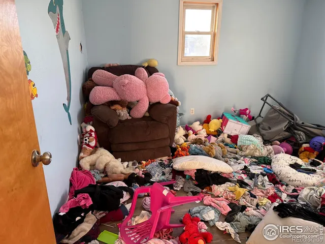 a view of a hallway with seating area