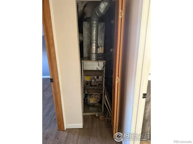 a view of a house with yard and sitting area