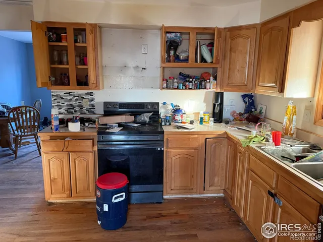 a kitchen with blue cabinets and sink