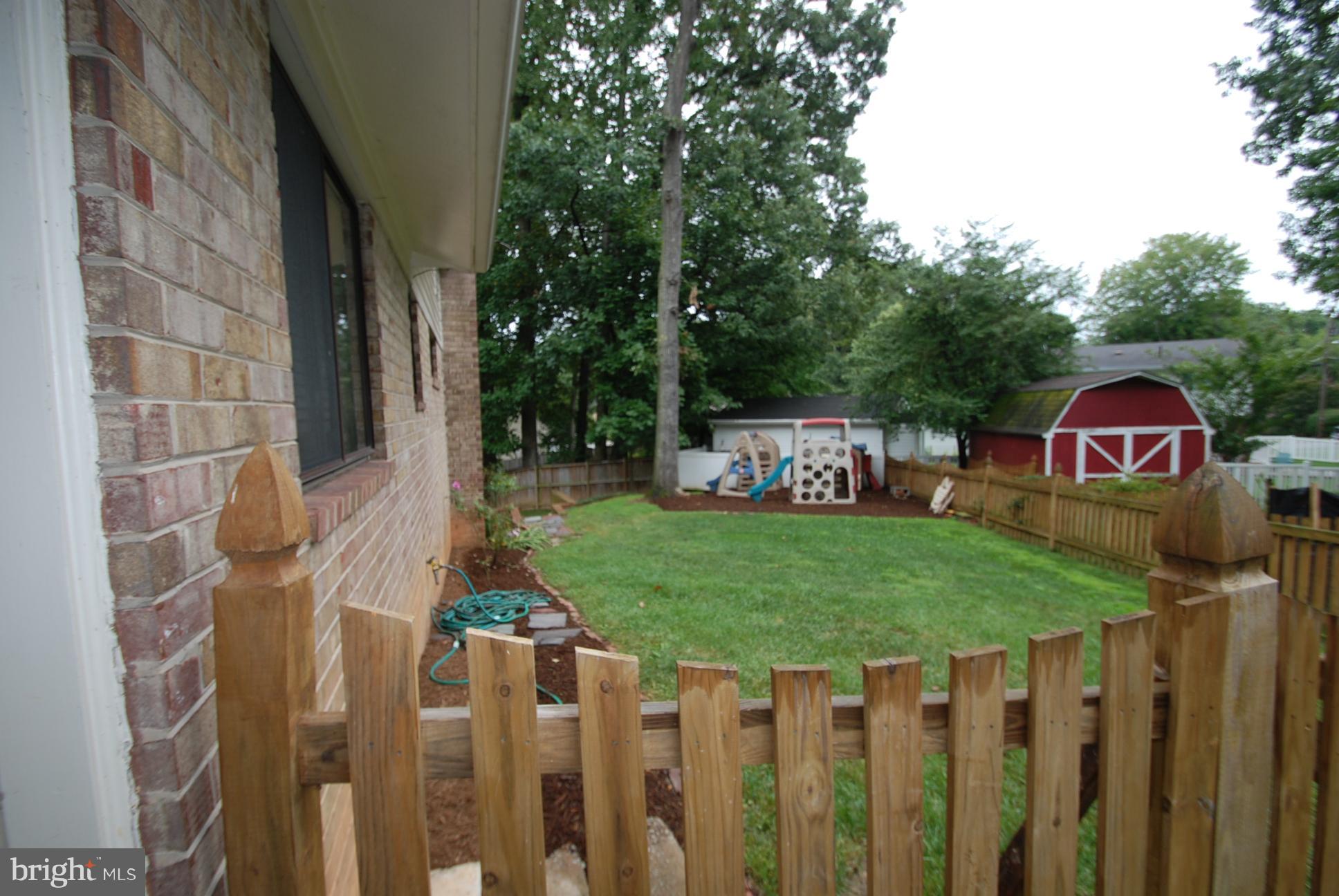 6803 Quebec Court Springfield, VA 22152 - Photo 2 of 17 Fenced in side yard off carpot