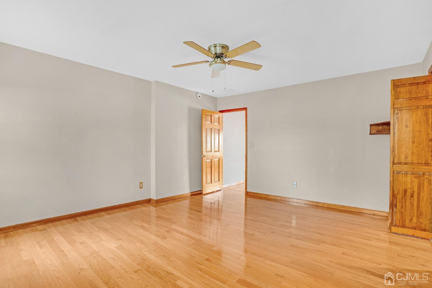 44 Terry Avenue Edison, NJ 08820 - Photo 19 of 47 a view of an empty room with wooden floor and a window