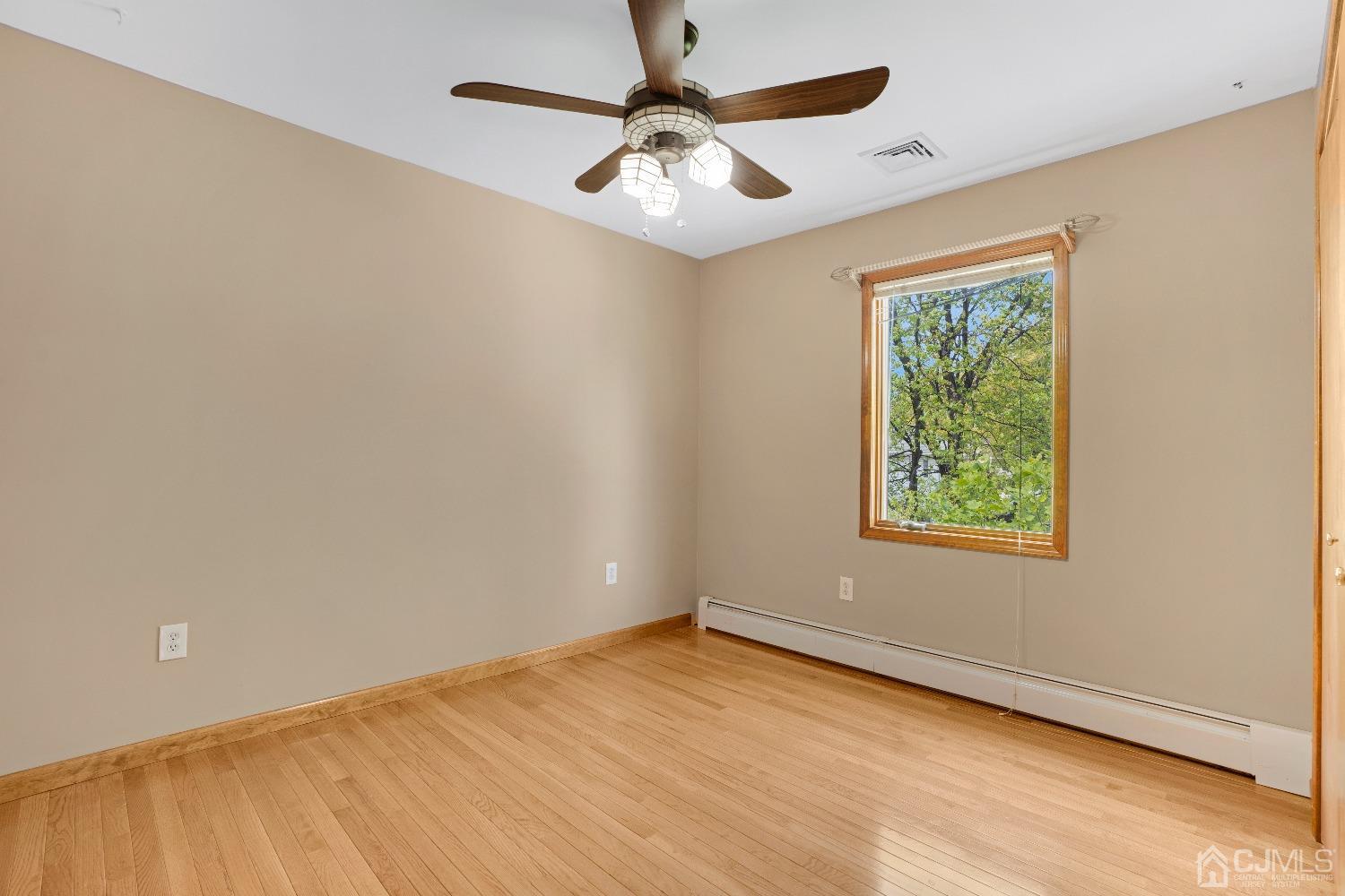 44 Terry Avenue Edison, NJ 08820 - Photo 27 of 47 an empty room with windows and fan
