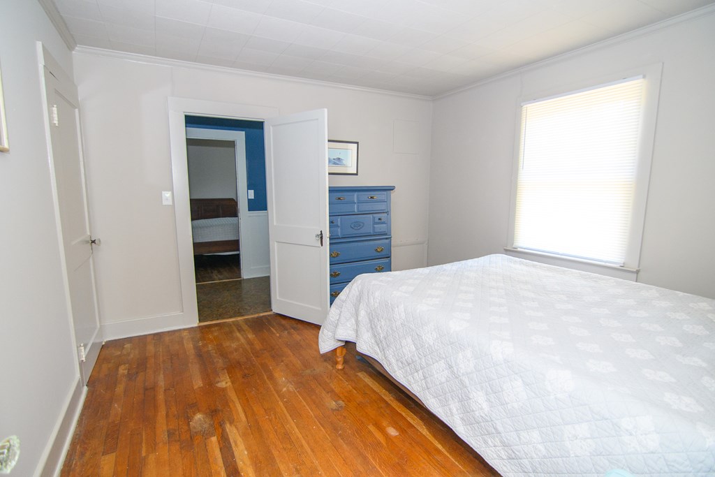 24432 Maxwell Street Parksley, VA 23421 - Photo 22 of 39 a bedroom with a bed and closet