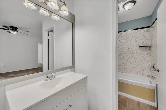 a bathroom with a bathtub and a sink