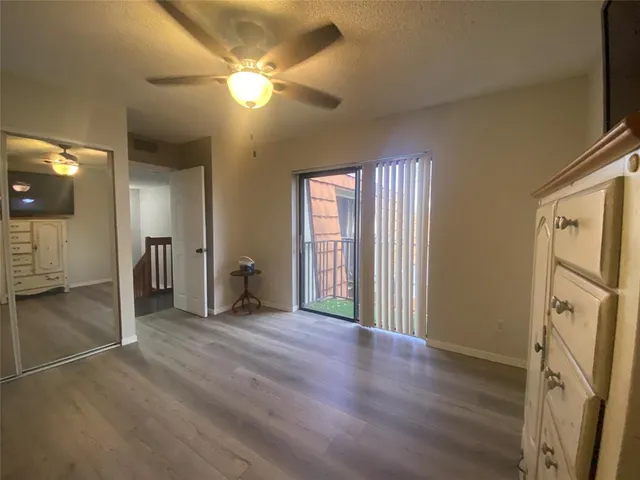 a view of an empty room with a fireplace