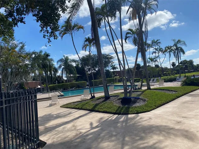 a park bench sitting in the middle of a park