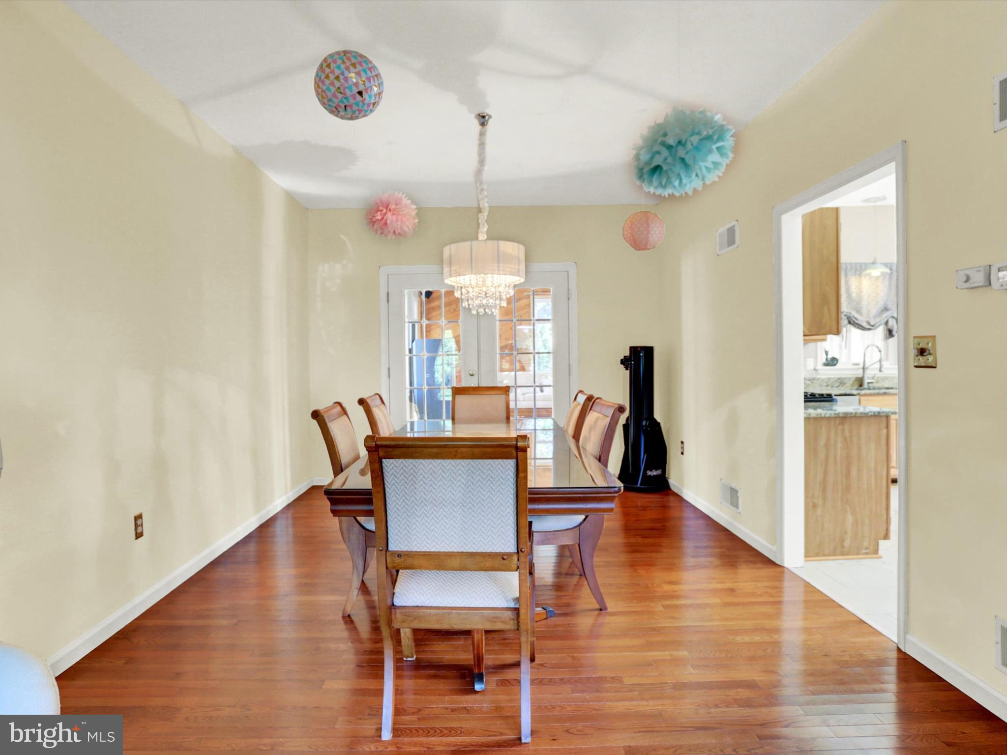 23 Pin Oak Street Palmyra, PA 17078 - Photo 13 of 65 a dining room with furniture a chandelier and wooden floor