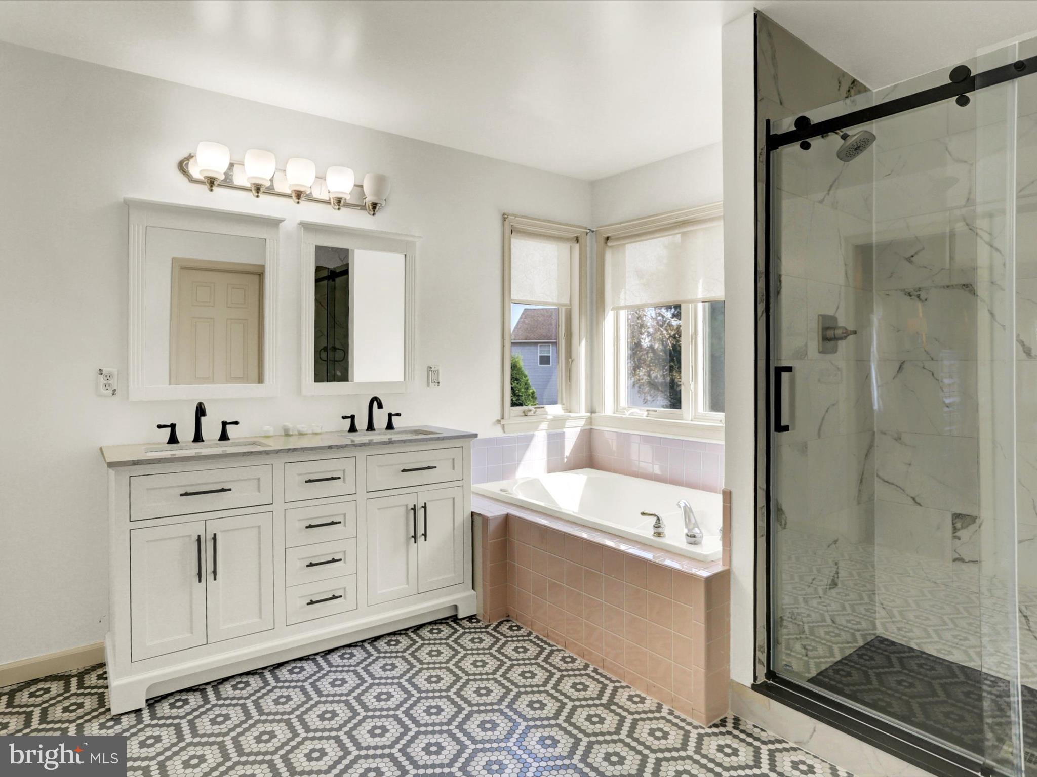 23 Pin Oak Street Palmyra, PA 17078 - Photo 35 of 65 a bathroom with a double vanity sink mirror and shower