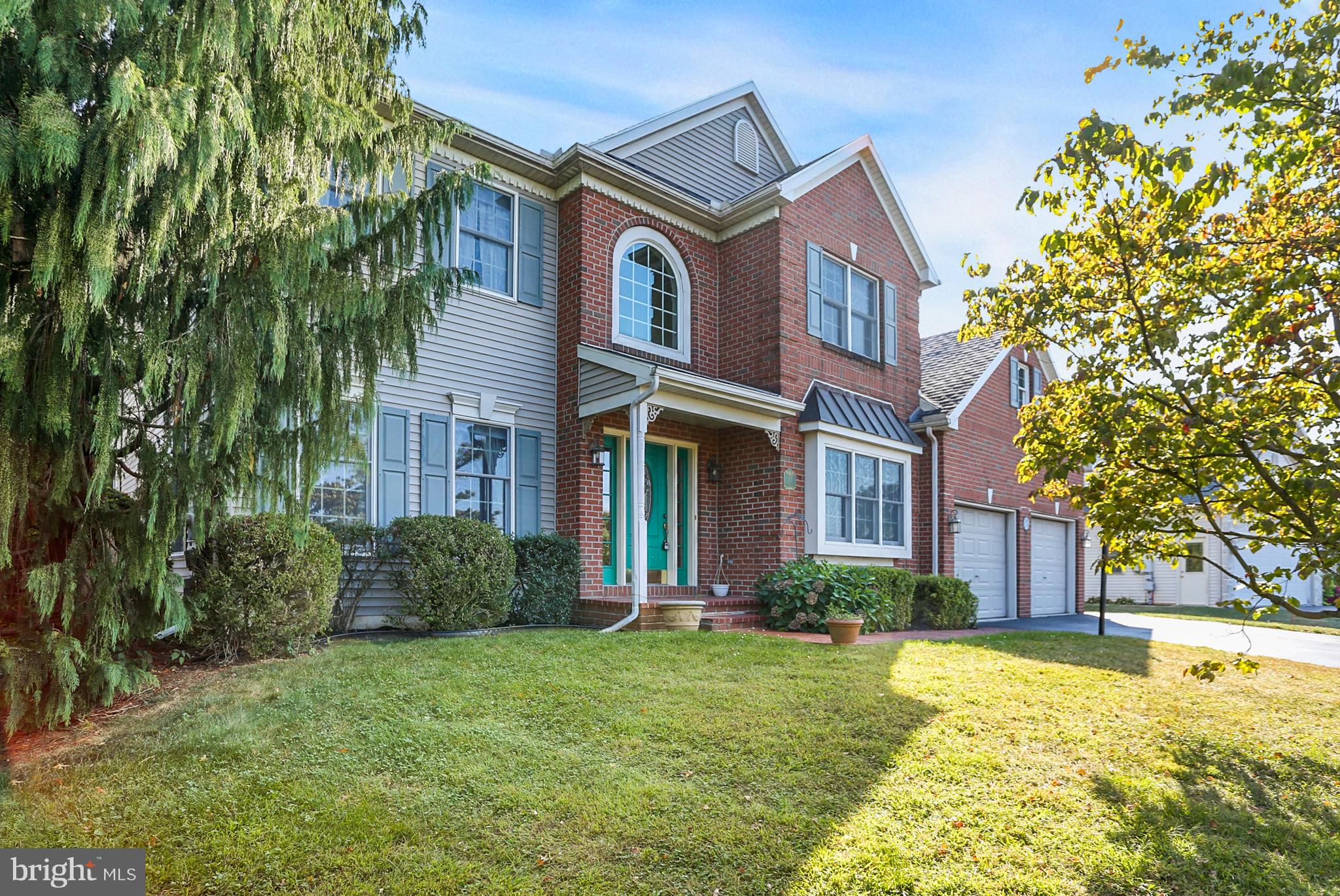 23 Pin Oak Street Palmyra, PA 17078 - Photo 4 of 65 a front view of a house with a yard