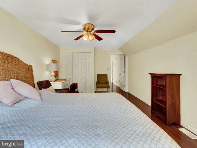 a bed room with a bed furniture and a flat screen tv