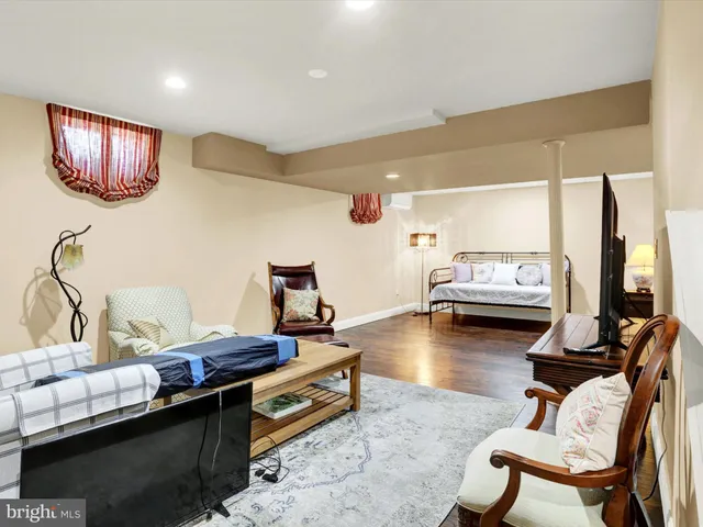 a view of house with backyard and furniture