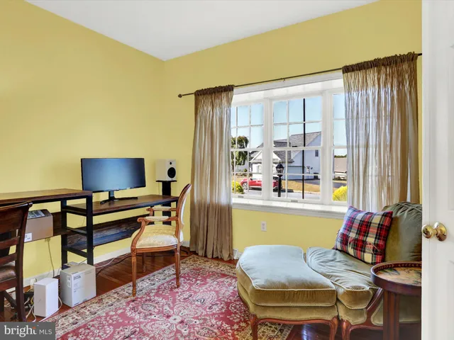 a living room with furniture and a rug