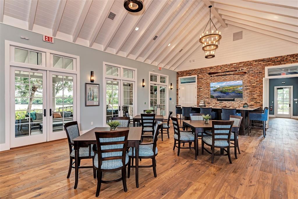 1603 Rio Vista Terrace Parrish, FL 34219 - Photo 11 of 22 a view of a dining room with furniture window and wooden floor