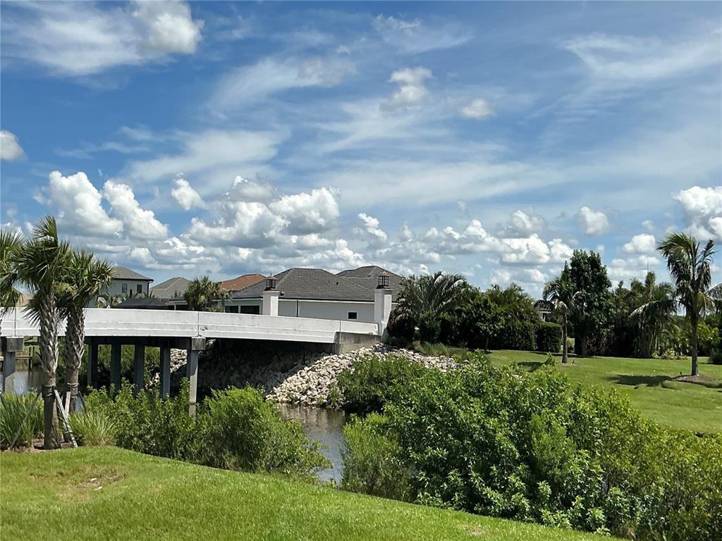 1603 Rio Vista Terrace Parrish, FL 34219 - Photo 22 of 22 a view of a garden with a building in the background