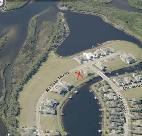 a view of a lake with houses in the back